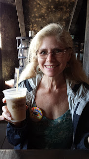 Rebecca Black with a butterbeer inside the Leaky Cauldron