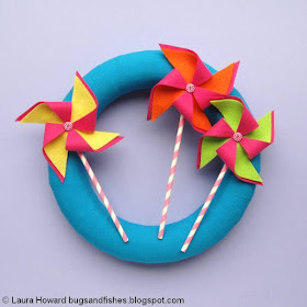 fabric-wrapped wreath decorated with handmade felt pinwheels