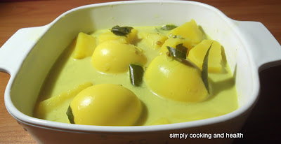 Boiled eggs in coconut milk with turmeric and lime juice  ( Sothi )