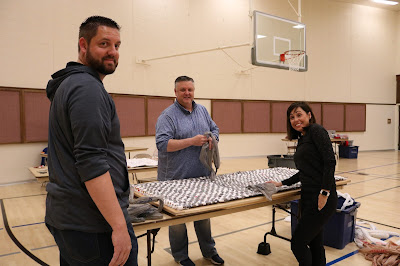 Weaving plastic sleeping mats for Stitching Hearts Worldwide