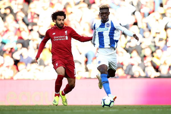 Mohamed Salah of Liverpool battles for posession with Yves Bissouma of Brighton and Hove Albion during the Premier League match between Liverpool FC and Brighton & Hove Albion at Anfield on August 25, 2018 in Liverpool, United Kingdom.