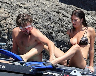 Looking trim, tan, and terrific, Camila Morrone, 21, stunned yet in bikini at Nerano, Italy. The incredible lady was snapping enjoyed her snorkeling momentt with boyfriend, Leonardo Di Caprio, 43, on Monday, August 8, 2018.