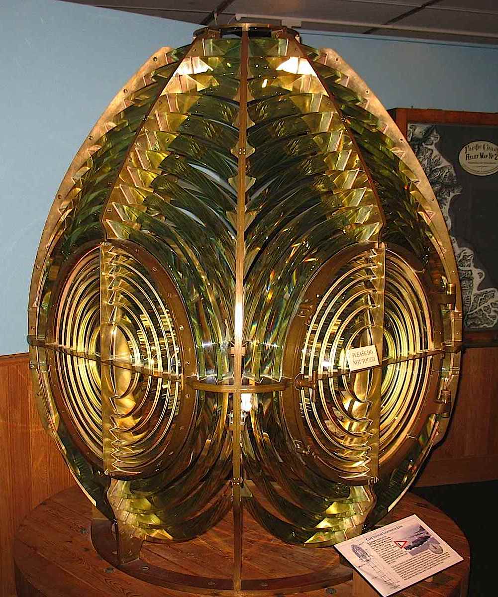 an old amber glass lighthouse lens, color photograph