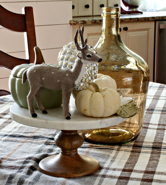 Deer and pumpkins as fall centerpiece in dining room - www.goldenboysandme.com