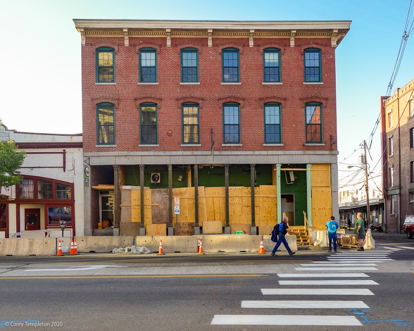 Portland, Maine USA June 2020 photo by Corey Templeton. Appears that 94 Commercial Street is getting a face lift. The building had a pretty noticeable tilt developing.