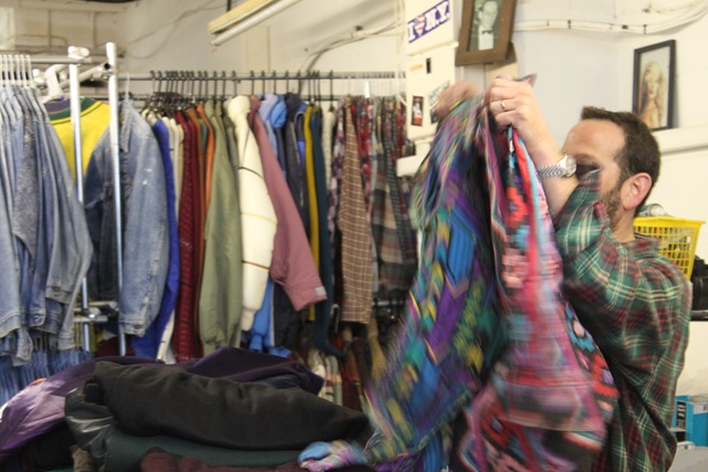 Daniel sorting through some stock and showing off a favourite aztec print Jacket. 