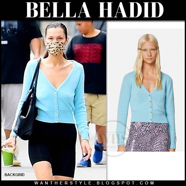 Bella Hadid in blue cardigan and black shorts
