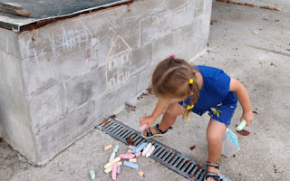 Playing with her chalks