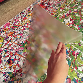 Removing contact paper from the front of a large puzzle