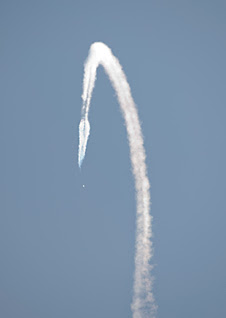 A NASA F-18 dives toward a targeted area of Edwards AFB during a SonicBOBS calibration flight.