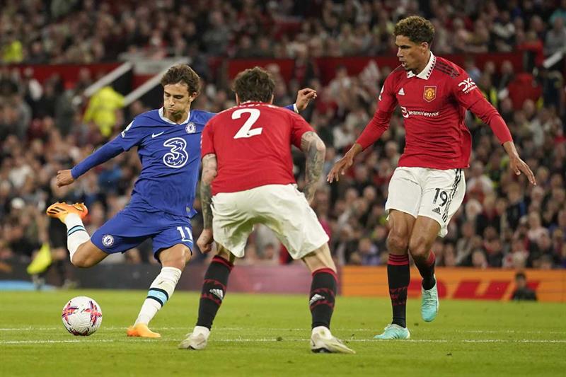 Chelsea s Joao Felix, left, scores his side s opening goal during the English Premier League soccer match between Manchester United and Chelsea