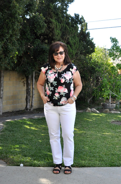 fashion white jeans and black floral blouse