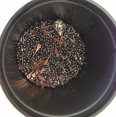 Tumbler barrel with flattened wire sticks to be tumble polished