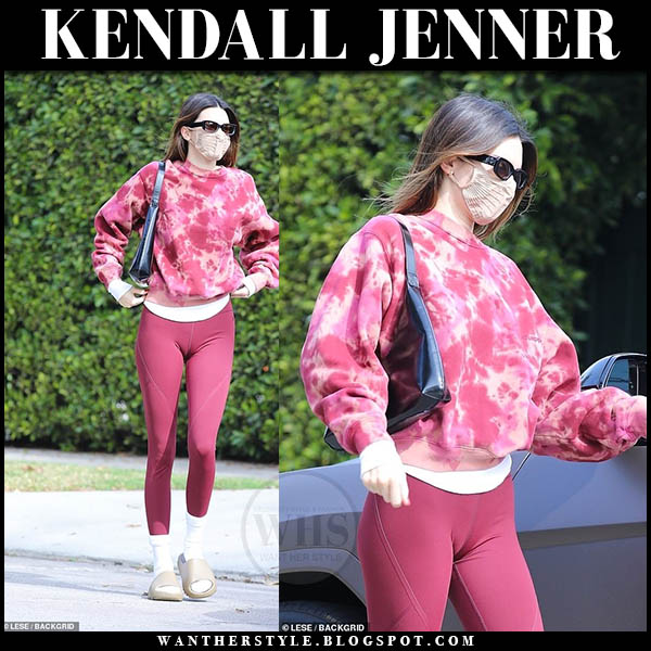 Kendall Jenner in pink tie dye sweatshirt, pink leggings and slides