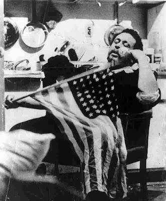 picture of Charles Mingus with flag from mingusmingusmingus.com