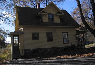  yellow house for sale at 70 Crescent Street, Winsted, CT