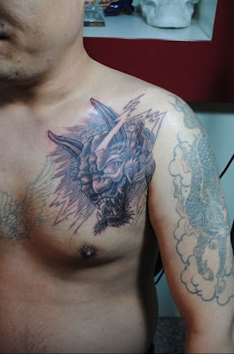dragon and demon head tattoo design