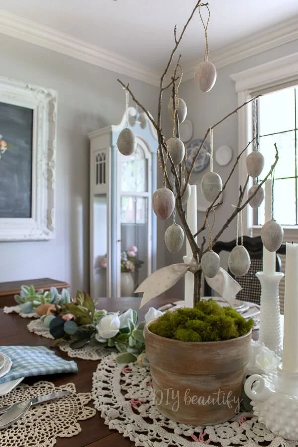 antiqued eggs on DIY tree for a pretty Easter centerpiece