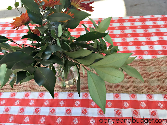 Don't overthink your outdoor wedding. Go easy with these Simple Rustic Floral Wedding Centerpieces from www.abrideonabudget.com.