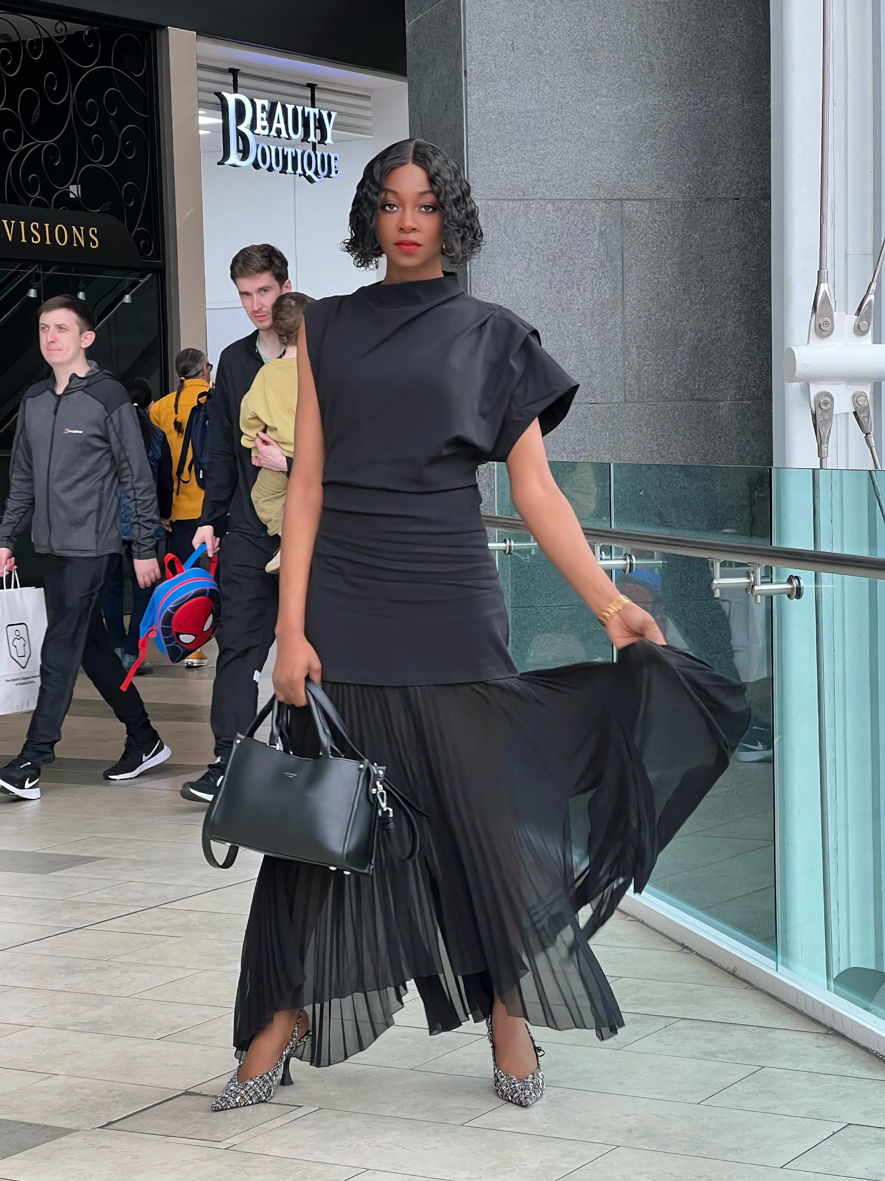 Blogger wearing zara limited edition ruched pleated dress