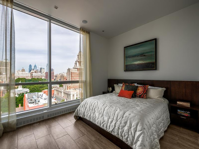 Photo of king size bed in the bedroom with the view