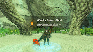 Dispelling Darkness Medal - An award for one who has conquered the darkness by lighting up every lightroot. This special item commemorates blessings received.