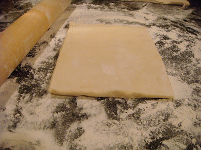 puff pastry dough square and rolling pin