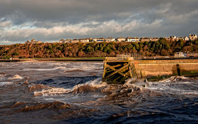 Photo of Maryport's north pier in a choppy sea