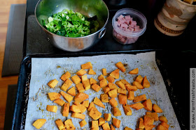 ingredients for making this recipe: roasted butternut squash cubes, a bowl of shredded brussels sprouts, and a bowl of ham cubes