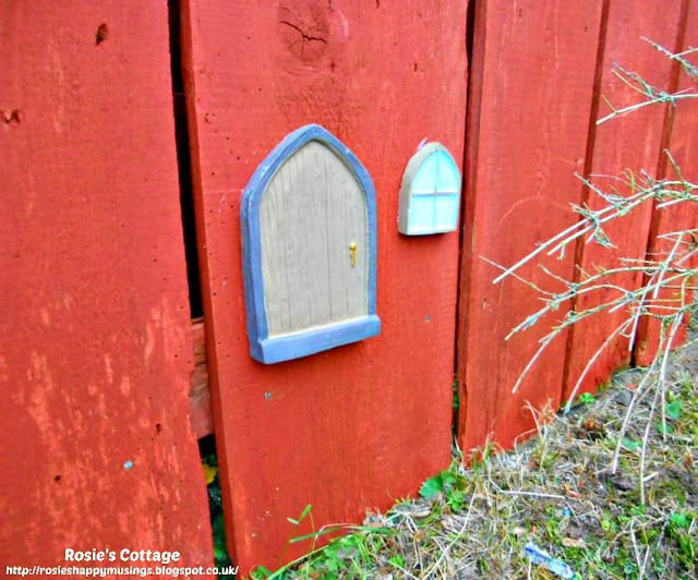 The little fairy door and window are fixed in place on the garden fence in the front garden.