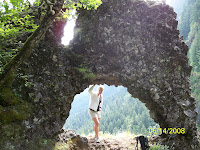 Loni under the arch. Huge drop, right behind her.