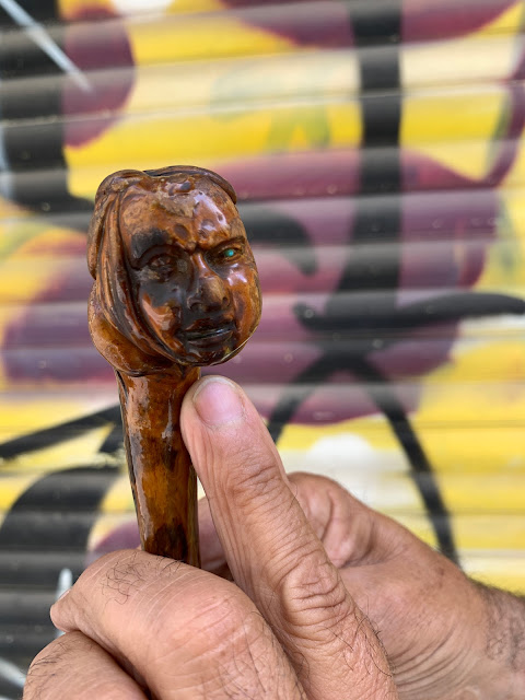 carved face in olive wood cane