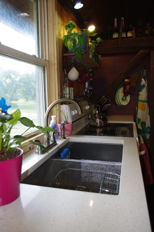 Note the laminate countertops and lack of cabinets. The only cabi title=