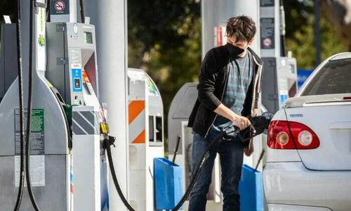 Gas stations serve customers at peak prices in Irvine, Calif., on Feb. 23, 2022. (John Fredricks/The Epoch Times)