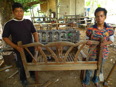 An antique bed which is being converted into a bench. Alwee Abd Rahman (left) and his son Alhuzaifi Alwee are maintaining their family's living heritage of carpentry skills.