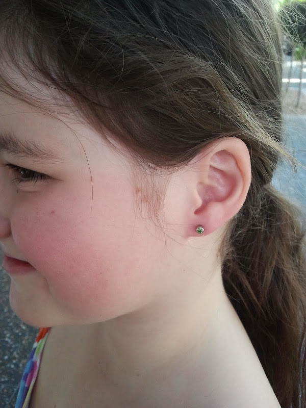took my 9 year old daughter, Miss A, to get her ears pierced today. title=