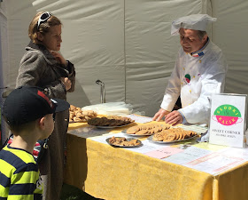 Biscuit baker on stall with custom from Polish mother and her son