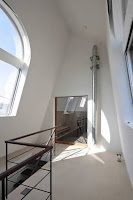 Japanese Vertical House Design Boasts Different Sized Windows and Openings