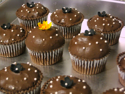 Extra Cupcakes with Black Flowers and Yellow and Orange Flower - Close-Up