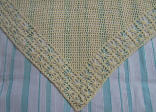 Sweet Nothings Crochet free crochet pattern blog ; photo of the Latticed spider shawl draped on a bed