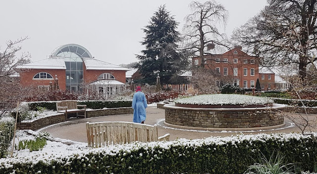 Snowy scene with retreatant circumambulating the burial mound