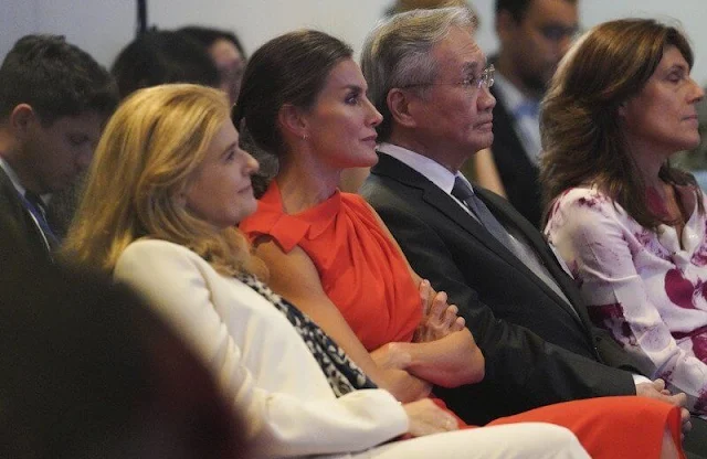 Queen Letizia wore a new red narciso rodriguez gathered midi dress by Zara. Executive Director Catherine Russell and Qu Dongyu