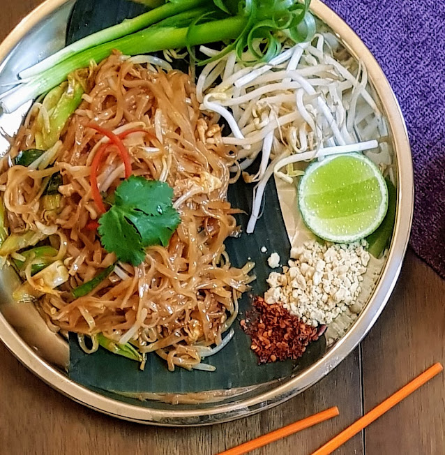 real pad thai with lime pea nuts cilantro and chilies