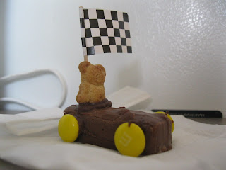 Cheryl built mini candy bars into race cars with Teddy Graham cracker drivers and M&M wheels