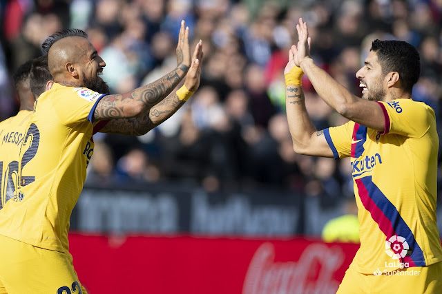 Suarez and Vidal celebrate scoring for Barcelona against Leganes