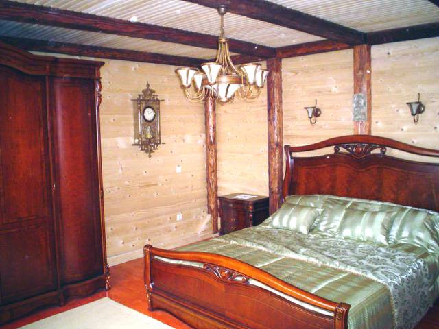 Bedroom in the wooden house