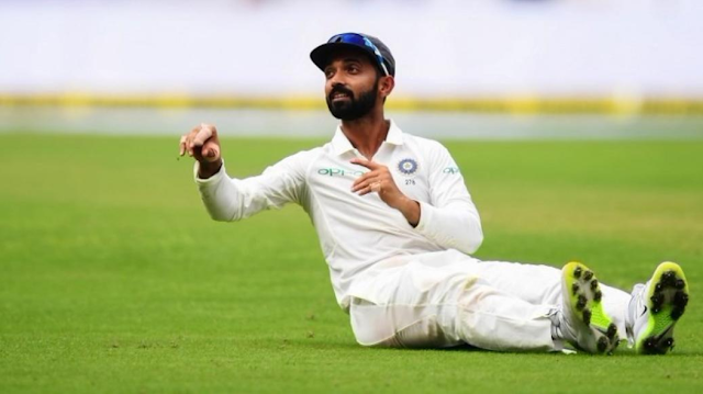 Ajinkya Rahane seating on the ground