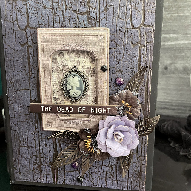 Lit Halloween book box decorated with Tim Holtz Halloween Idea-ology; Tim Holtz Distress Inks and Sprays; and Tim Holtz Sizzix Haunted House Thinlit and Cracked A5 Texture Fade embossing folder.