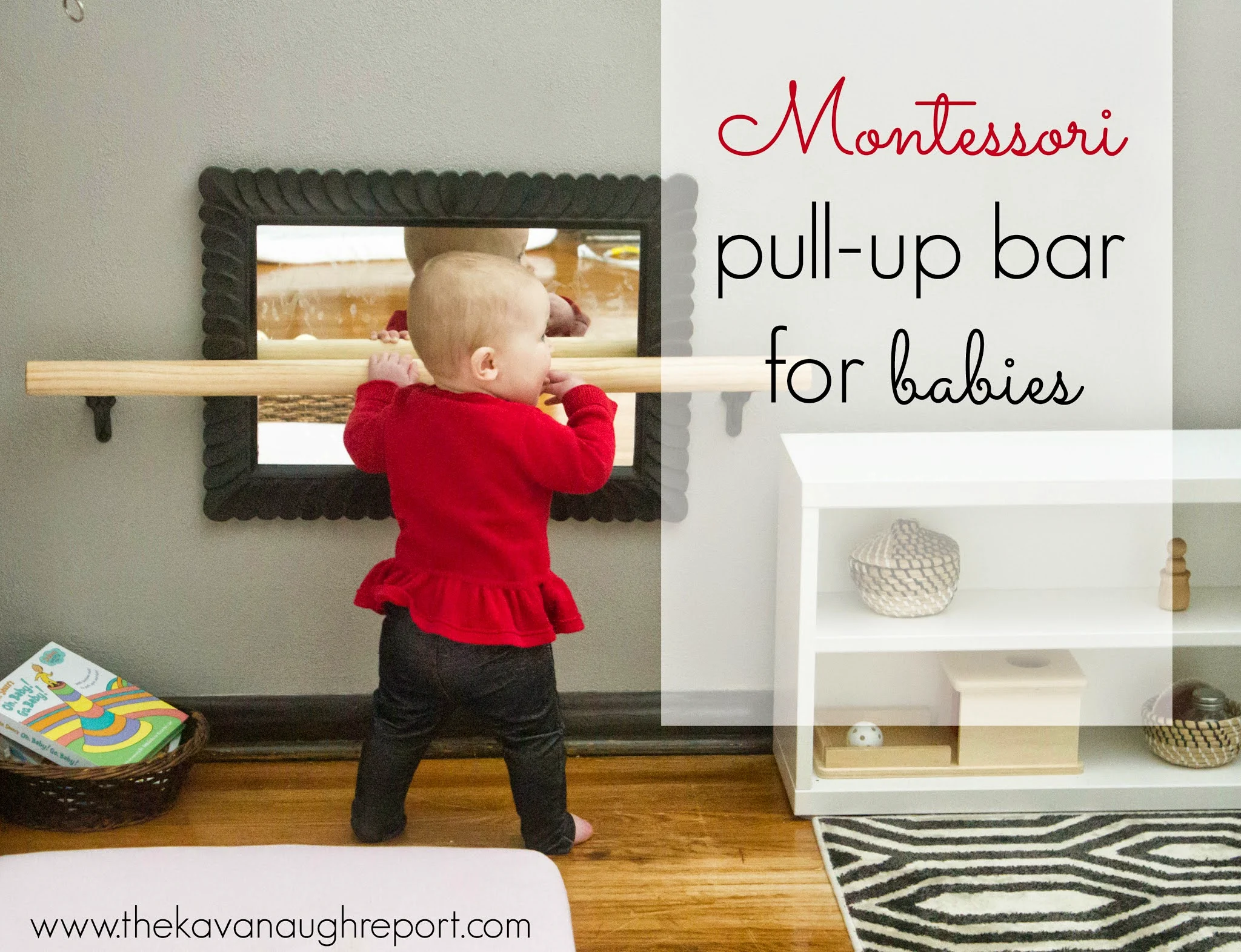 Montessori infant stands at diy pull-up bar and looks into mirror.