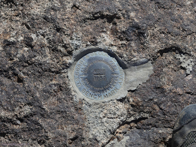 09: bronze cap on a rock